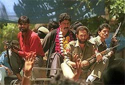 Bilal Lone, chief of the People's Conference, guarded by securitymen