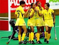 New Zealands keeper Helen Clarke is left on the ground