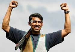 Indias Rajyavardhan Singh celebrates after winning gold medal