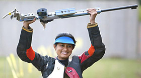 Indias Anjali Bhagwat celebrates after winning the gold medal