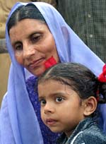 Shahnaz holds her daughter