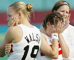 England players Kate Walsh and Jennie Bimson show their disappointment