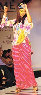 A model jives to the Hare Rama Hare Krishna number immortalised by Zeenat Aman at the Sunsilk Hair fashion show in the Capital.