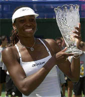 Venus Williams holds up another championship crystal
