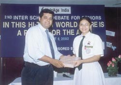 Ananya Banerjee of Mothers International School being awarded the winners trophy