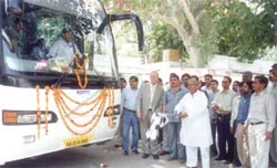 Mr Banwari Lal, Minister of Transport, Govt of Rajasthan, flagging off the luxury bus
