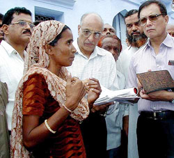 Chief Election Commissioner J. M. Lyngdoh talks to a riot victim 