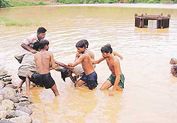 Villagers of Seonk take a drowned youth, Amit, out of the waters of Jayanti Dam, 5 km from Chandigarh, on Sunday.