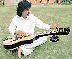 Musician Subhash Ghosh, with his invention, the sarasveena, a blend of sarod, sitar and guitar.