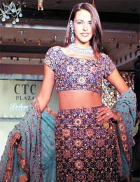 A model displays a traditional lehnga dress