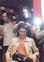 A Lakme hair care expert with a model.