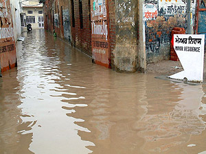 Ankle-deep water outside Amritsar Mayor Sunil Dattis residence at Chheharta after torrential rain on Monday evening.