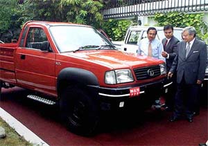 Officials of Tata Engineering and Locomotive Company attend the launch of the firm's new pick-up truck 
