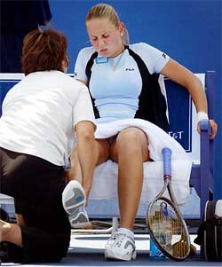 Yugoslavia's Jelena Dokic has her leg examined by a trainer