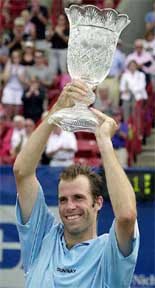 Britains Greg Rusedski holds the championship trophy