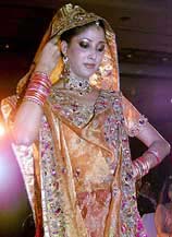 A model displays a bridal wear during a fashion show