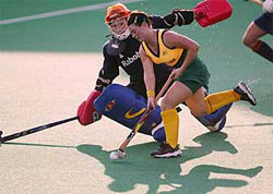 Australia's Peta Gallagher is blocked by Clarinda Sinnige, goalkeeper of the Netherlands