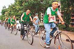 Tibetan students take part in a world peace cycle rally on the Panjab University campus