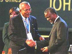 South African President Thabo Mbeki greets UN Secretary-General