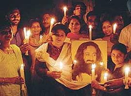 Members of ‘‘Art Of Living’’hold a candlelight procession to create awareness about pollution caused by the excessive use of polythene bags at Model Town in Ludhiana