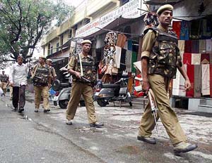Paramilitary jawans patrol in crowded Mandir Bazar