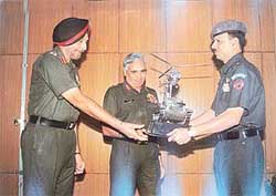 The Chief of Western Army Command, Lieut-Gen S. S. Mehta , presents the flight safety trophy