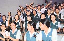 A section of students in a jubilant mood at a prize distribution function in Tagore Theatre