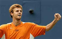 Gustavo Kuerten of Brazil celebrates his win