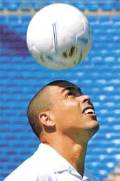 Real Madrids new Brazilian star Ronaldo heads the ball during his presentation ceremony at Santiago Bernabeu stadium