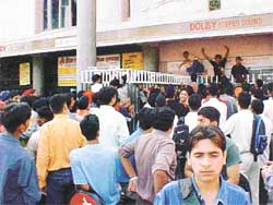 School students jostle for the tickets of the controversial adult film Ek Chotti Si Love Story 
