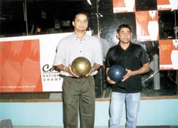 Indian cricketers Murali Karthik and Vijay Dahiya trying their hands at bowling in the National Bowling Championship