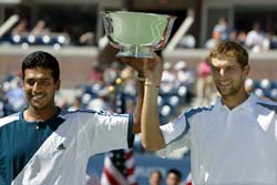 Mahesh Bhupathi  of India and Max Mirnyi of Belarus hold their trophy after winning the US Open mens doubles title