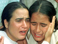 The daughters of Mushtaq Ahmed mourn his death