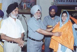 Students, parents and teachers of GHPS, Shahdara, take part in the Amrit Chhakna ceremony