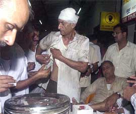 Doctors and para medical officers treating an injured person