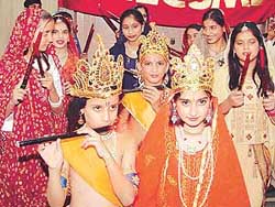 Students take part in a shobha yatra at Agar Nagar