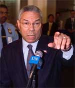 United States Secretary of State Colin Powell stops to talk to the news media
