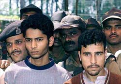 BSF jawans look from behind Habib Hisham and Mohammed Ashraf