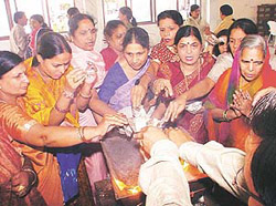 Devotees put Puran Ahuti on Sugandh Dashmi Mahaparav celebrated at Shri Digamber Jain Temple in Sector 27, Chandigarh, on Monday.