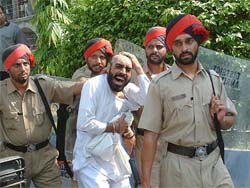 An ETT student being taken away by the Punjab Police