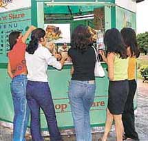 Youth flock to an eating joint for a quick bite in the city