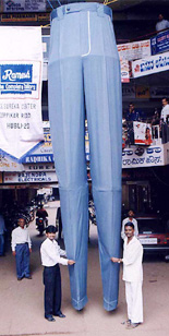 Tailor Srikant Belamakar and his co-workers show the 17 feet long trouser