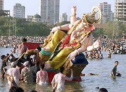 Devotees place the idol