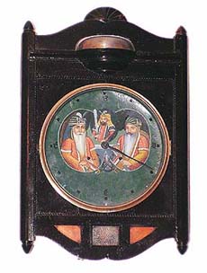 An ancient clock with a painting of Maharaja Ranjit Singh, a general of his and Hari Singh Nalwa 