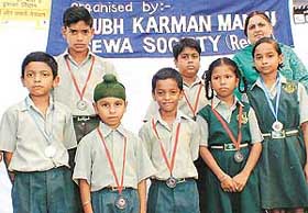 Students of St Vivekanand Public School, Bhabhat, who were honoured during a seminar on the school premises near Zirakpur on Saturday.