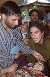 Relatives cry near the body of Maimoona Akhter