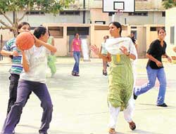 Students enjoy a game of basketball on the eve of the summer sports festival at the GNIMT on the Gujarkhan campus 