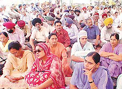 Members of the Punjab and Chandigarh College Teachers Union hold a dharna in Ludhiana on Tuesday.