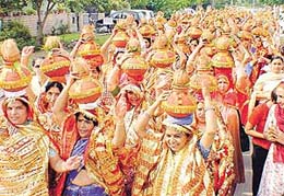 Devotees take part in a kalassh yatra on the eve of the arrival of Sant Asaram Bapu