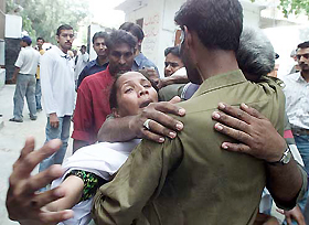 Relatives mourn the death of a worker at a Christian organisation, killed in an attack by unknown gunmen in Karachi on Wednesday. 